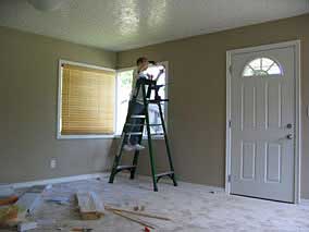 Using a ratchet set to drive hex-head screws for window blind brackets
