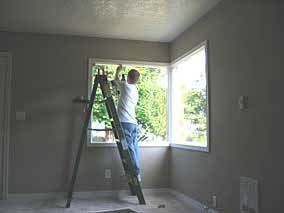 Using my cordless drill to drive screws for window blind brackets