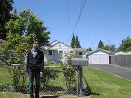 Yuki in front of their newly-acquired first house
