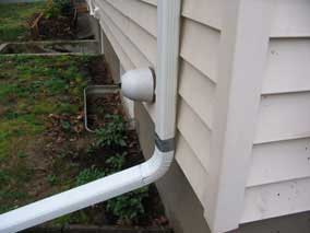 Downspout extension with white trash duct tape solution