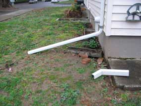 Downspout extension with white trash duct tape solution