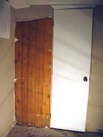 Wood tongue-and-groove paneling behind drywall