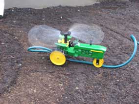 John Deer tractor traveling sprinkler