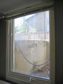 Screen installed on basement casement window