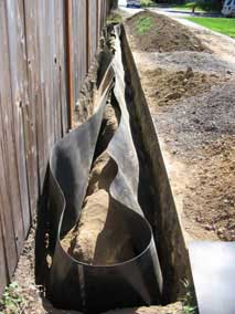 Completed bamboo barrier assembly and trench
