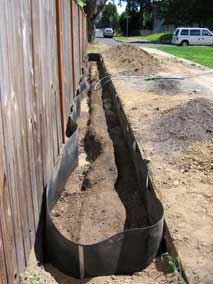 Trench partially filled and watered down
