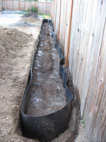 Trench partially filled and watered down