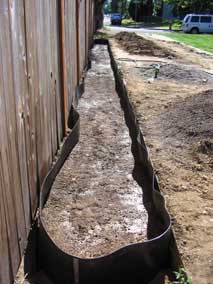 Trench partially filled and watered down