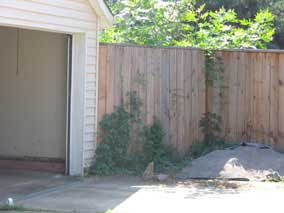 Fence tying back to northwest corner of garage