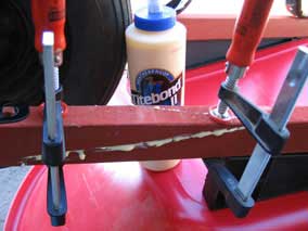 Attempting to repair broken wheelbarrow arm