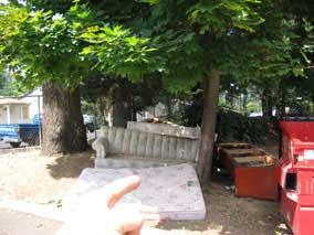 Nate points out the abandoned couches and mattresses at the apartments across the street