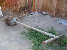 Clothesline pole after dragging out from behind the garage