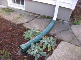 Downspout with flexible vinyl extension