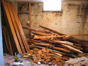 Wood stacked and piled in basement from demolition
