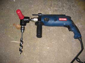 Hammer drill, 90-degree adaptor, and auger bit