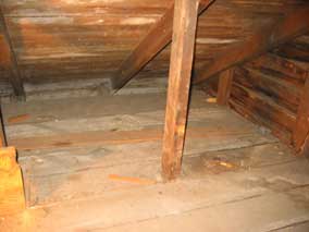 Back corner of garage attic with some wood removed
