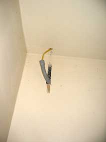 Ugly workaround for running electrical wiring up into garage attic
