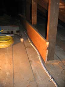 Electrical wiring in garage attic enclosed in conduit