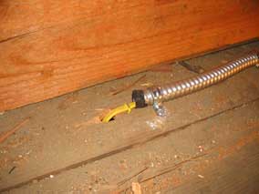 Electrical wiring in garage attic enclosed in conduit
