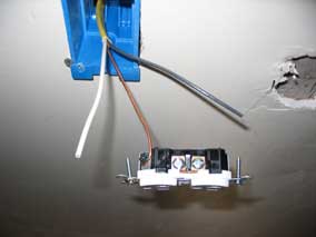 Bare wire attached to green screw for ground