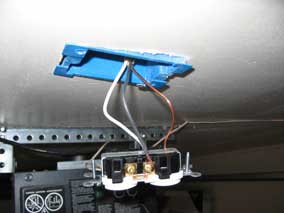 Black wire attached to gold screw on hot side