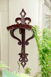 Ornate garden hose bracket at Flavel House, Astoria, Oregon