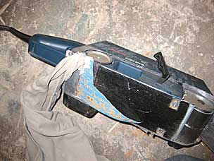 Shirt tail caught in belt sander