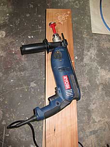 Forstner bit in corded drill to start leg mortise