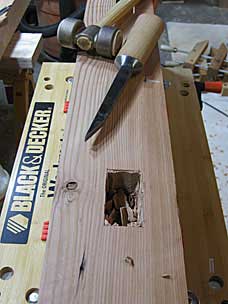 Chopping the waste with a mortise chisel