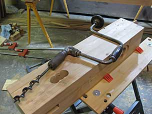 Brace and auger bit to drill holes for through mortise