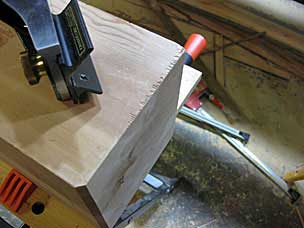 Chamfering bottom of leg with block plane and chamfering guide