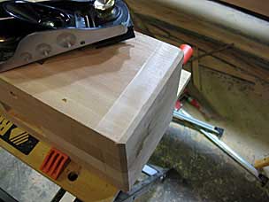 Chamfering bottom of leg with block plane and chamfering guide