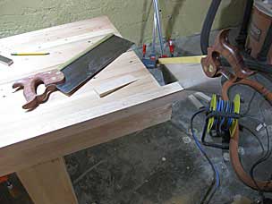 Sawing wedge to hold workbench top in place