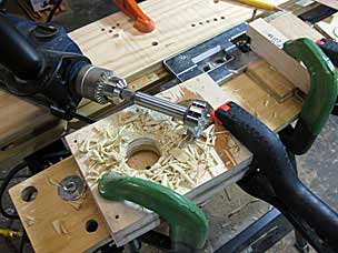 Cutting hole for vise screw garter groove