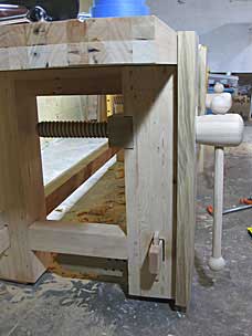 Main and sliding vises in place on workbench