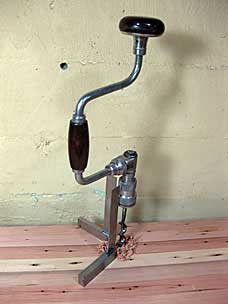 Drilling hole for holdfast in workbench top
