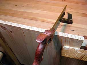 Sawing pins on tool chest side