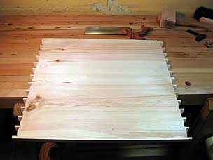 Tool chest side with dovetail pins roughed out
