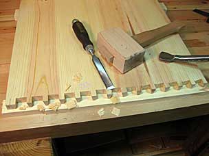 Chopping waste between pins on tool chest side