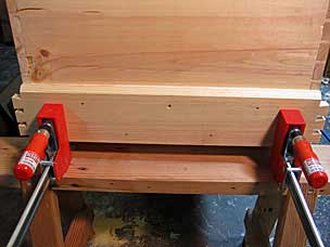 Tool chest side skirt board glued and nailed