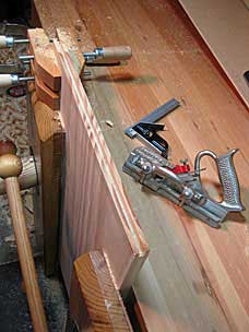 Plowing groove in tool chest lid panel