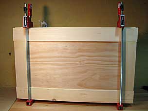 Tool chest lid frame and panel glued and clamped