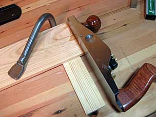Squaring end of bottom tray floor board