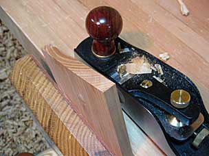 Bottom tray floor board with squared end