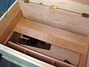 Floor boards of lower sliding tray sitting on runners