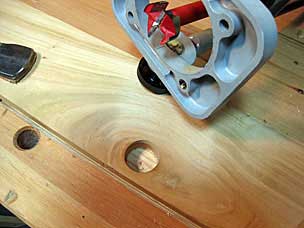 Pull hole drilled in front board of bottom tray
