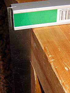 Front edge of top has moved out of alignment with front face of leg