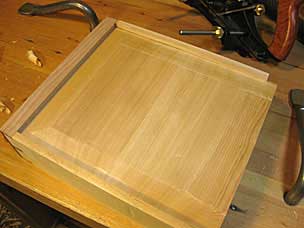 Drawer bottom fitted into drawer