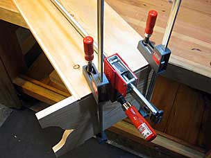 Clamping warped boards for six board chest before driving nails