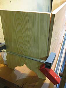 Clamping warped boards for six board chest before driving nails